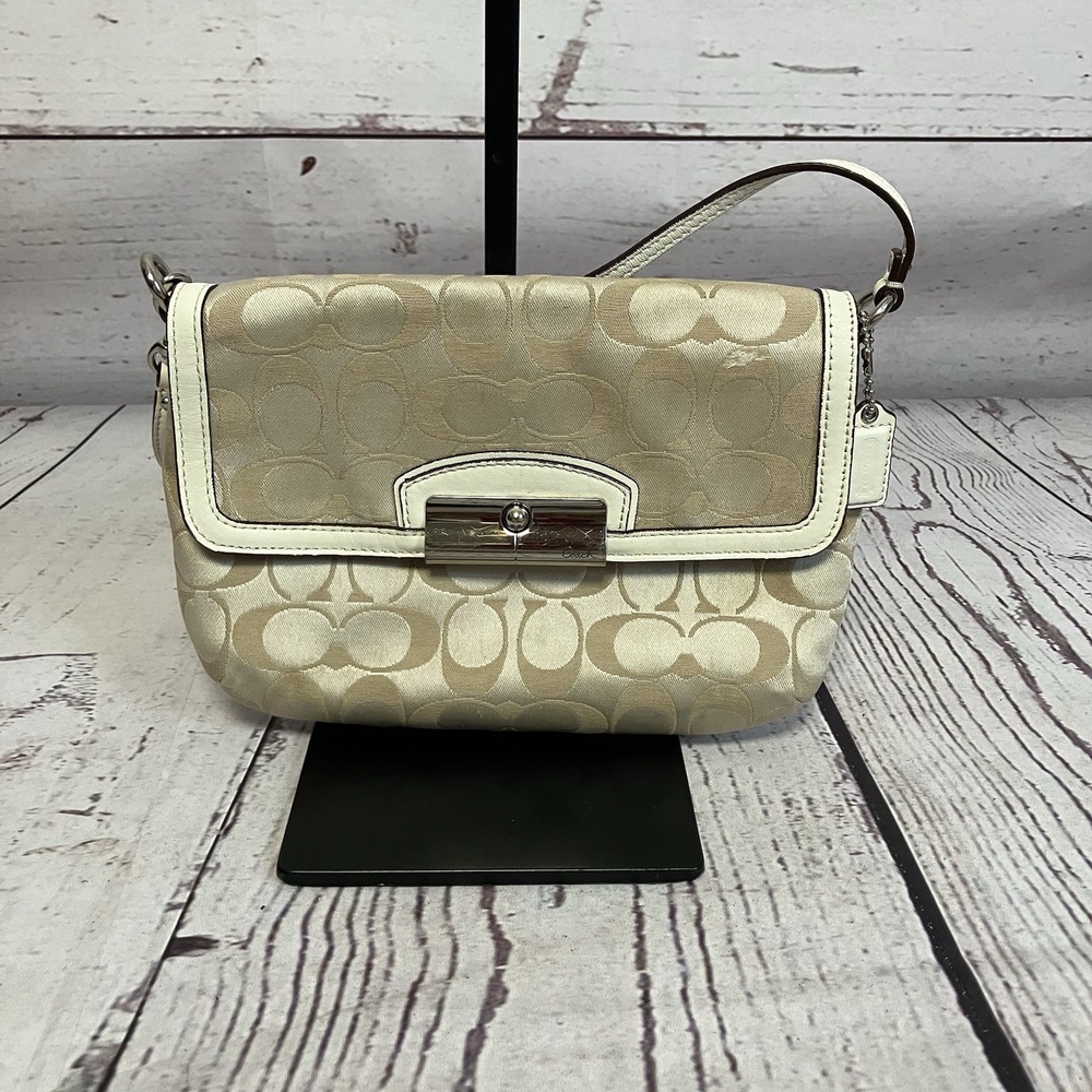Coach Handbag Cloth material with embossed leather tag‎ logo leather trim